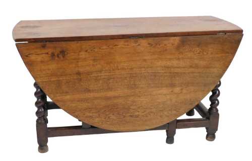 A large 19thC oval gate leg table, on spirally turned supports, adapted, 75cm high, 139cm wide,...