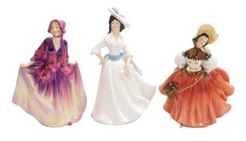 Three Royal Doulton figures, modelled as The Skater HN2117, Margaret HN2397, and Sweet Anne HN1496.