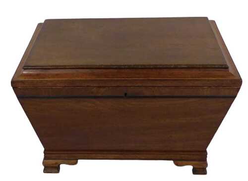 An early 19thC mahogany sarcophagus shaped cellarette, the hinged lid enclosing a vacant...
