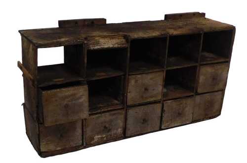 A bank of painted pine shop or workshop drawers, some missing, 42cm high, 90cm wide, 23cm deep....