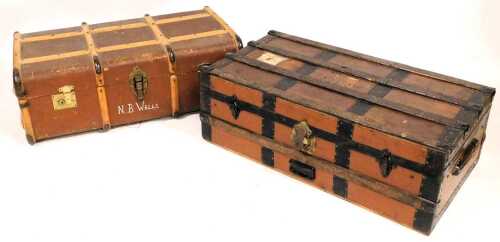 A metal and canvas cabin trunk, applied with various luggage labels, 31cm high, 94cm wide, 49cm...