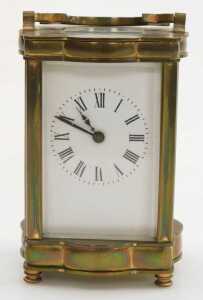 A late 19thC serpentine fronted brass cased carriage clock, rectangular dial bearing Roman... - 2