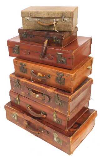 An early 20thC leather case, with plated mounts, 70cm wide, and six other mainly leather cases....