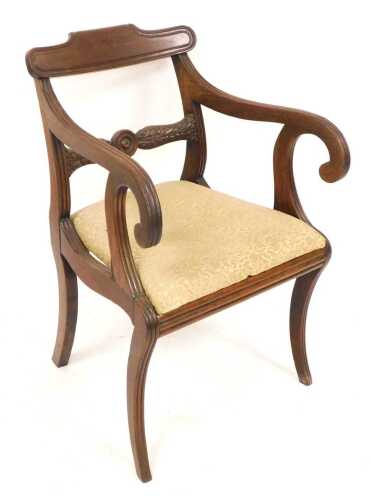 A Regency mahogany carver armchair, with a shaped bar back, a leaf carved and roundel support,...