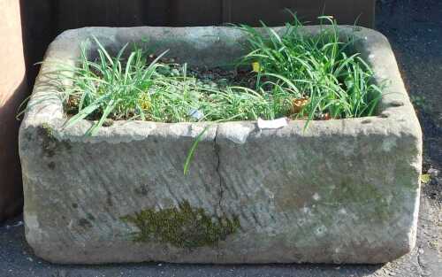 A D shaped stone sink, 21cm high, 53cm wide, 40cm deep. (AF)