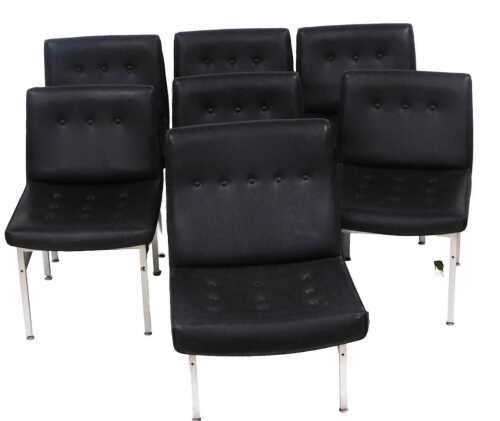 V - A set of seven Scandinavian style 1960s/70s lounge chairs, each with a buttoned black leather...