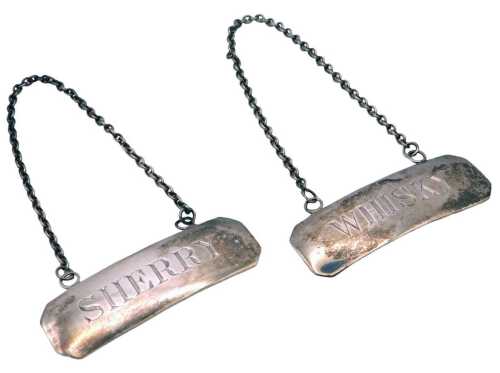 A pair of Irish silver decanter labels, with chain suspensions, engraved for Whisky and Sherry,...