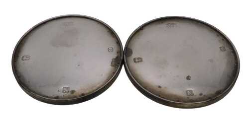 A pair of Elizabeth II silver coasters, probably loaded, London 1994, 7.03oz all in.