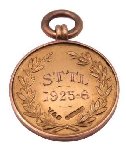 A 9ct gold medal, engraved with a laurel wreath, and "S.T.T.L 1925-6", verso Gas Co "A" F.J, 6.3g.