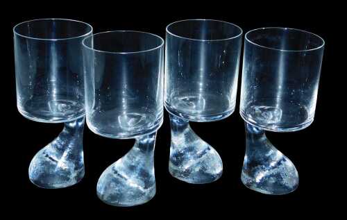 A set of four Joe Colombo for JC Riedel wine glasses, each with a foot shaped stem.