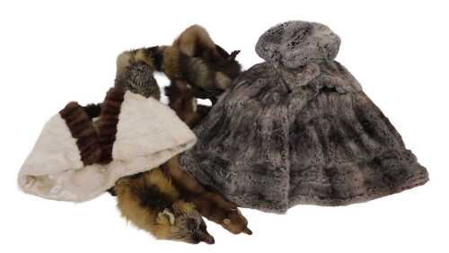 A two tone fur cape, a short fur jacket with similar hat, a double mink stole, a fox stole, etc.