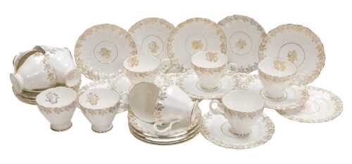 A H.F. Wedgwood and Co porcelain tea service, decorated with gilt flowers, comprising, twelve...
