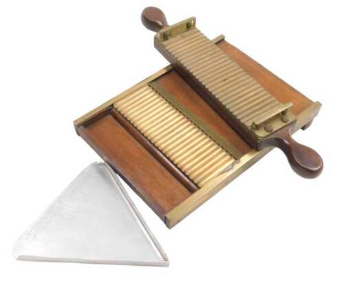 A mahogany and brass pharmacist's pill sorter, and a further aluminium sorter stamped Evan's...