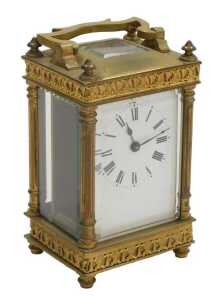 A late 19thC brass cased carriage clock, rectangular enamel dial bearing Roman numerals, single...