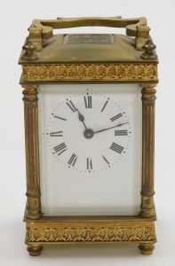 A late 19thC brass cased carriage clock, rectangular enamel dial bearing Roman numerals, single... - 2