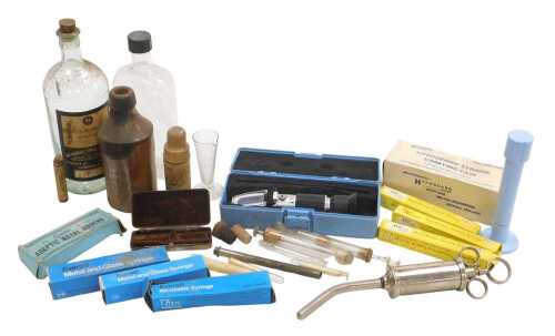 Various medical accessories, to include syringes, a portable refractometer, a 19thC stoneware...