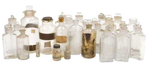 A quantity of chemist's bottles, some to include original labels. (1 tray)