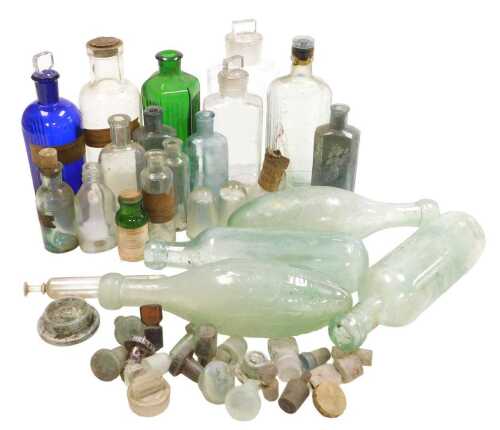 A quantity of chemist's bottles, mineral bottles, etc., some bearing original labels.