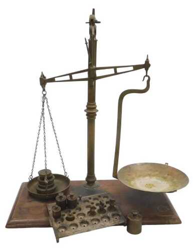 A set of brass and mahogany chemist's scales, with some weights, 60cm high, 50cm wide.