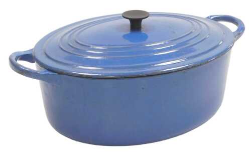 A Le Creuset blue enamel oval two handled casserole dish, 32cm wide. (AF)