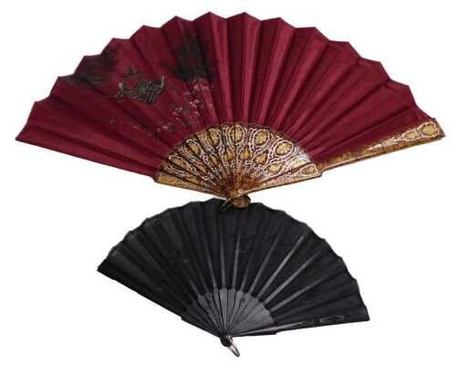An early 20thC Continental red silk fan, indistinctly signed, decorated with birds on a raft...