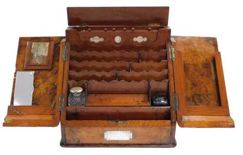 A Victorian burr walnut stationery cabinet, with two sloping doors enclosing a fitted interior,...