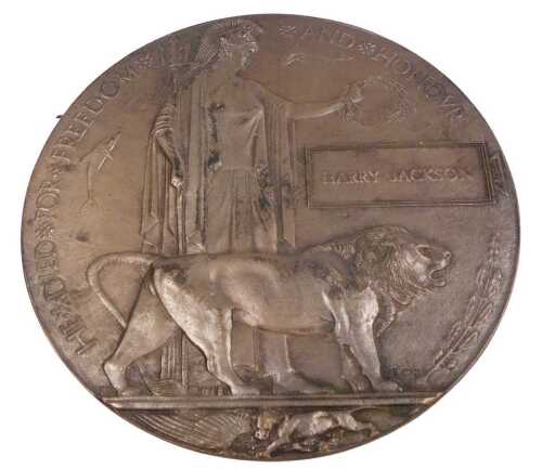 A World War I bronze widow's penny, named to Harry Jackson.