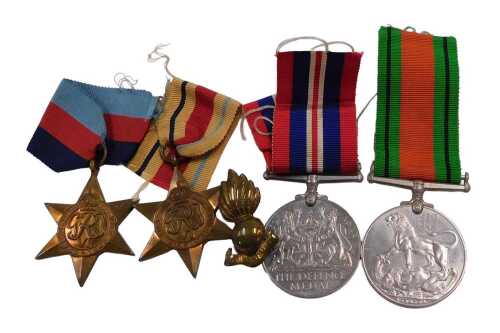 A group of World War II medals, comprising the Africa Star, 1939-45 Star, Defence Medal, and War...