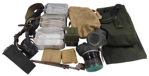 Assorted military collectables, including a spike bayonet, mess tins, gas masks, and a World War...