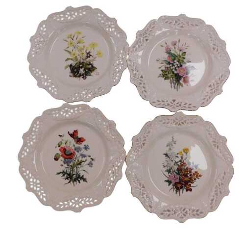 A set of four Royal Creamware limited edition floral gift plates, issued by Bradford Exchange,...