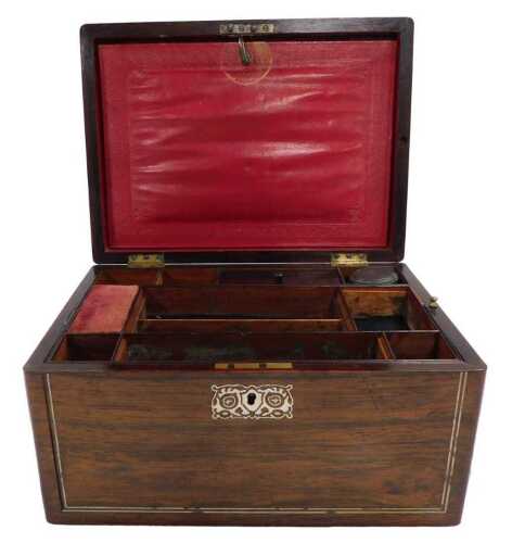 A Victorian rosewood and mother of pearl inlaid workbox, the hinged lid enclosing various...