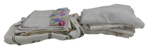 Various embroidered and lace tablecloths, to include floral examples, etc.