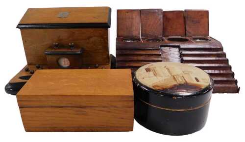 An oak desk stand, with three compartments for ink, and a sloping pen rest, 27cm wide, a...