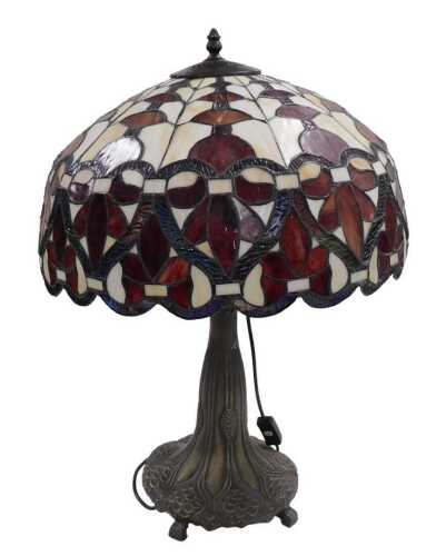 A Tiffany style table lamp, with a red and cream leaded shade, 46cm diameter, and a simulated...