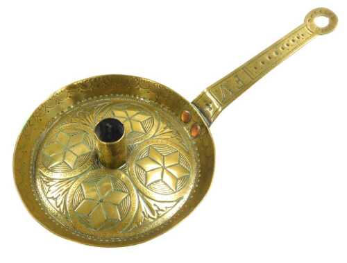 A 19thC Arts and Crafts chamber candlestick, with punched decoration of roundels, initialled FV,...