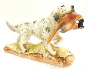 A group of porcelain and resin figures of setters, including Norcrest. (7) - 2