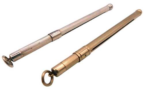 A 9ct gold cocktail swizzle stick, of propelling form, with engine turned decoration, 6.4g,...