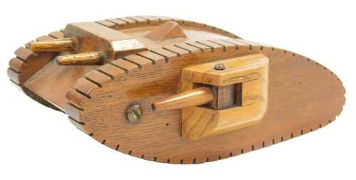 A scratch built mahogany and ash model of a First World War tank, 15cm long.