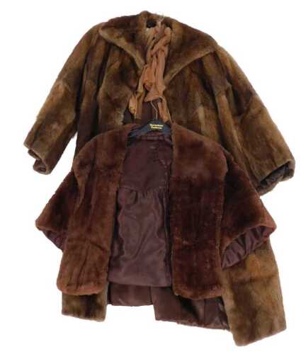 A brown fur coat, 110cm long, and a simulated fur short jacket. (2)
