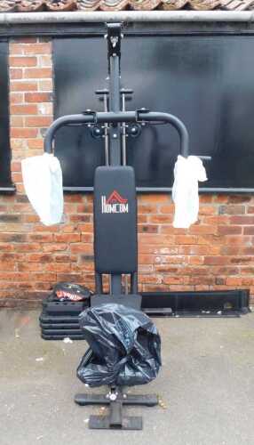 A Homcom multi-gym, with various weights.