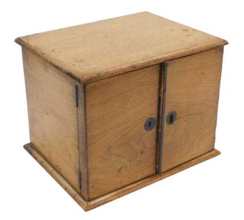 A Victorian mahogany and oak table chest, with two doors, opening to reveal two drawers, raised...