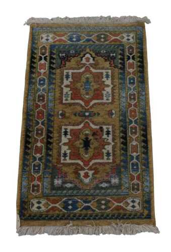 A Turkish light brown prayer rug, the central field with two floral medallions, within repeating...