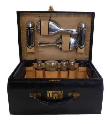 An early 20thC black Morocco leather vanity and writing case, by Stewart, Dawson & Co Ltd,...