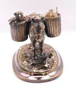 A late 19thC silver plated model of a donkey, with two baskets across its back, one holding a... - 2
