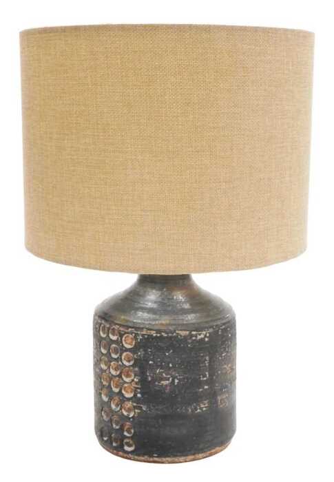A late 20thC studio pottery table lamp, of cylindrical form, with a black lace and pressed...