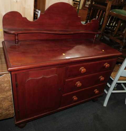 A stained pine Lincolnshire chest, the top with a raised back and shaped shelf, above a panelled...