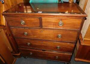 A 19thC mahogany and crossbanded chest, of two short over three long drawers, raised on...