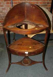 A 19thC mahogany and line inlaid corner wash stand, 100cm high.