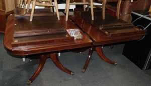A mahogany twin pedestal extending dining table, 74cm high, the top 160cm x 110cm, with two...