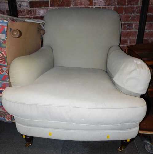 A contemporary armchair in Howard and Sons style, upholstered in duck egg blue fabric, on turned...